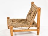 an old wooden chair with a woven seat on a white background
