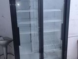 an image of a refrigerated refrigerator in a garage