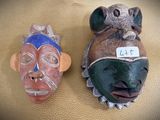 two masks that are sitting on a table