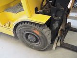 a forklift that is parked in a garage