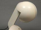 a white lamp that is on top of a table