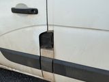 a white van with a black stripe on the side of it