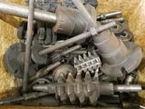 many different types of metal parts in a box