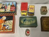 a lot of tins that are sitting on a table