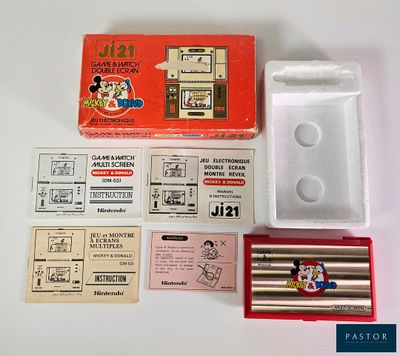 a box of pencils and a set of stamps on a table