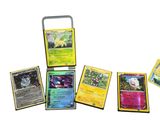 a lot of pokemon cards that are on the table