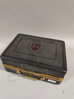 an image of a black and gold case with a shield on it