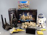 several lego star wars toys are on display on a table