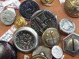 many different types of buttons on a table