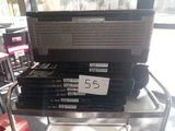 une pile de CD posée sur un chariot dans un magasin