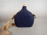a blue bottle with a brown strap on it