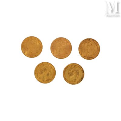 five gold coins are arranged in a row on a white surface