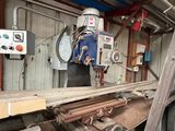 a machine that is working on a piece of wood