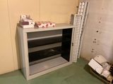 a metal shelf with a bunch of boxes on it