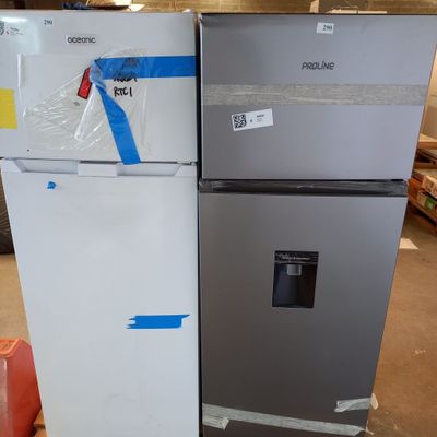 two refrigerators that are sitting in a warehouse