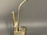 a metal pipe that is sitting on top of a table