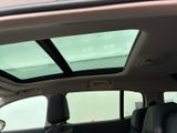 a view of the sunroof from inside of a car
