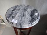 a marble top table with a sticker on it