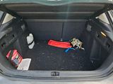a trunk of a car filled with items in the back of it