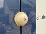 a sign on the side of a blue van that says delahand