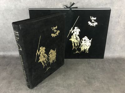 a black book with gold foil on it and a black cover