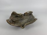 an image of a silver plate with a bird on it