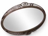 a round mirror with a decorative design on the rim