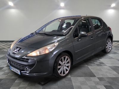 a picture of a grey car parked on a checkered floor