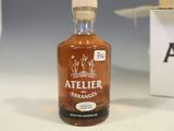 a bottle of alcohol sitting on a table next to a box