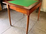 a small table with a green mat on top of it
