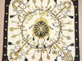 a black and gold scarf with keys and keys on it