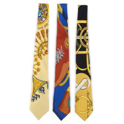 three ties with different designs on them on a white background