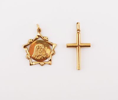 two gold crosses and a gold coin on a white background