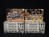 these are two boxes of action figures on a black background