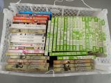 many dvds in a white basket on the table