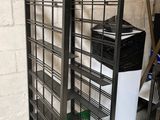 two shelves that have baskets on them in a room
