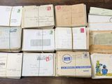 a lot of old letters and envelopes on the table