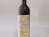 a bottle of wine that is sitting on a table