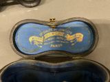 a blue case that has a pair of scissors in it