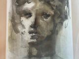 une image représentant un tableau représentant le visage d'une femme, dans un cadre blanc