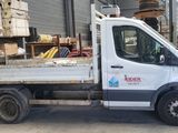 a white truck that is parked in a warehouse