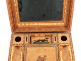 a small wooden box with a mirror on top of it