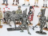 many figurines of soldiers on display on a table