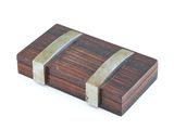 a small wooden box with two metal straps on it