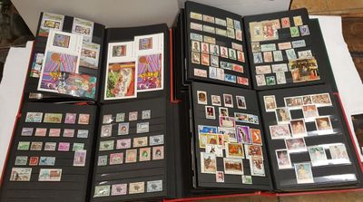 a lot of stamps in a folder on the floor