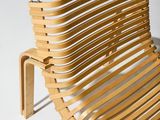 a wooden bench that is sitting on a white surface