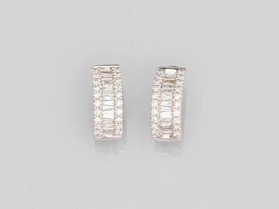 a pair of diamond hoop earrings