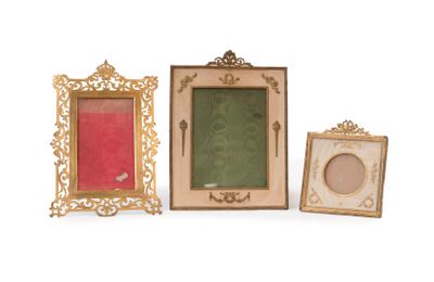 three picture frames are sitting next to each other on a white surface