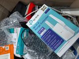 a cardboard box full of electronics and other items in it