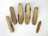 six different types of swiss army pocket knives on a white surface